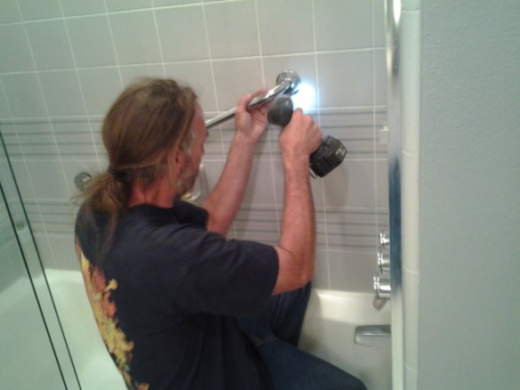 Fastening the grab bar through tile